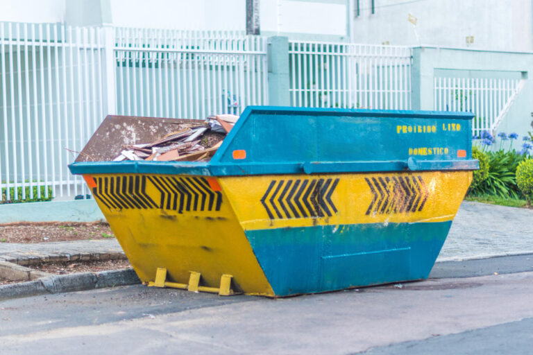 large skip container filled with various waste materials